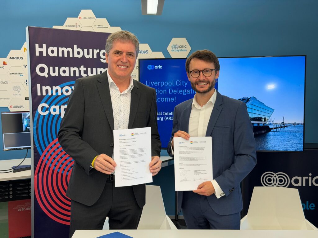 Liverpool City Region Mayor Steve Rotheram and ARIC CEO Alois Krtil at the signing of an MOU in Hamburg to develop a trans European supercluster